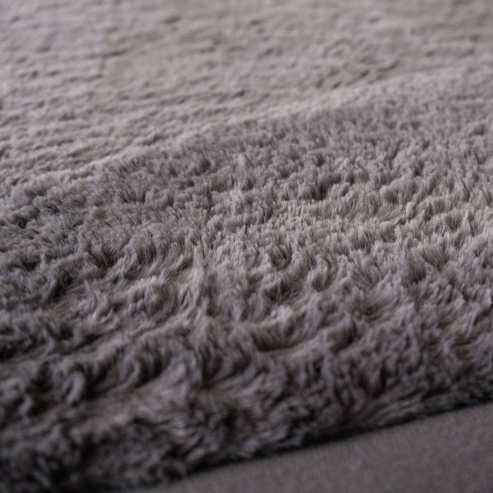 Close-up of grey textured fabric with a soft, fuzzy appearance.